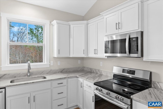 kitchen featuring sink, white cabinets, and stainless steel appliances