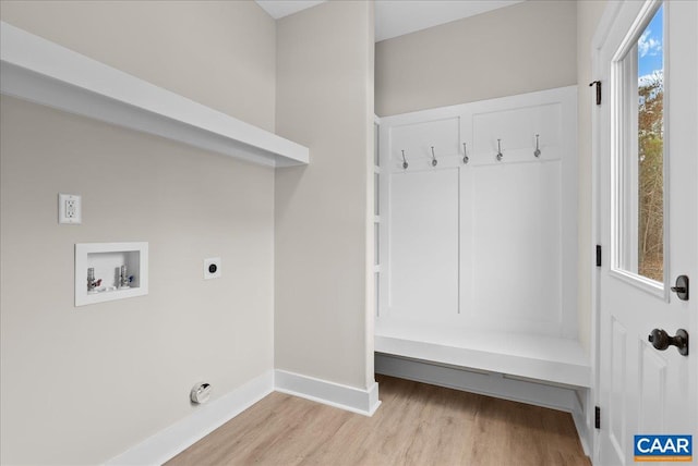 laundry area with washer hookup, hookup for an electric dryer, and light hardwood / wood-style floors