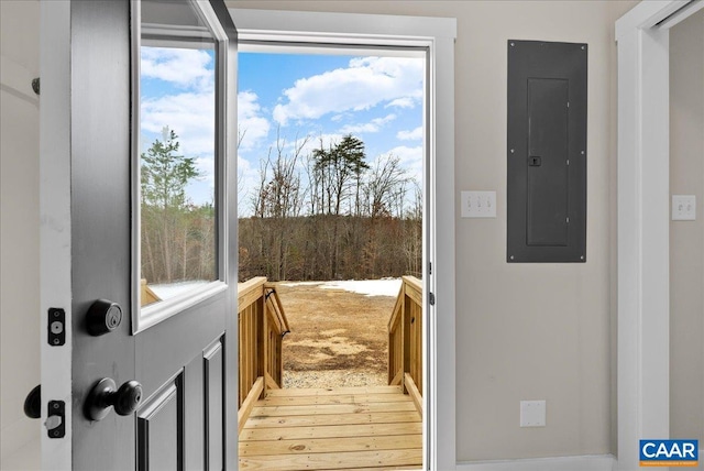 entryway with light hardwood / wood-style flooring and electric panel