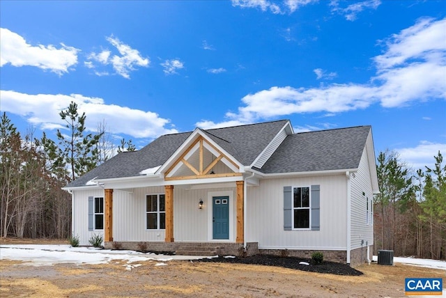 view of front facade featuring cooling unit and a porch