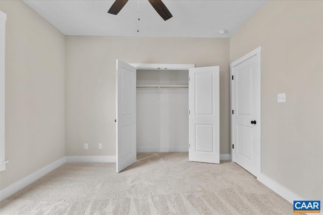 unfurnished bedroom featuring a closet, ceiling fan, and light colored carpet