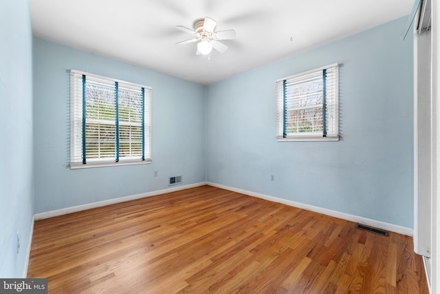 spare room with ceiling fan and light hardwood / wood-style flooring