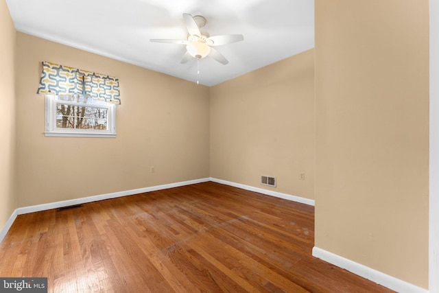 unfurnished room featuring hardwood / wood-style floors and ceiling fan