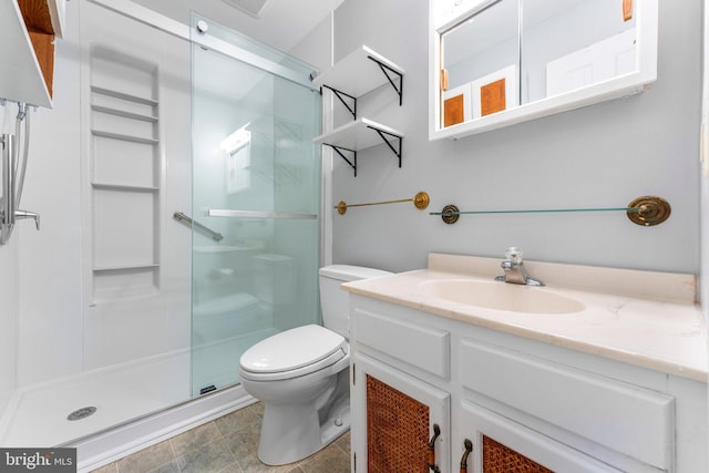 bathroom featuring walk in shower, vanity, and toilet