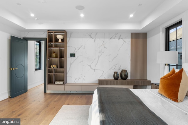 3819 NW Albemarle St NW, Washington, DC 20016 - bedroom with multiple windows, light wood-style floors, recessed lighting, and an accent wall