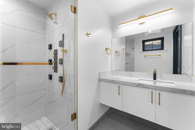 3819 NW Albemarle St NW, Washington, DC 20016 - bathroom featuring a marble finish shower, vanity, and tile patterned floors