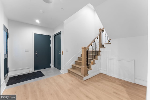 3819 NW Albemarle St NW, Washington, DC 20016 - foyer with light wood-style flooring and stairs