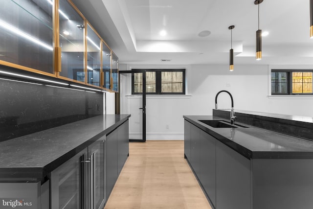3819 NW Albemarle St NW, Washington, DC 20016 - kitchen featuring light wood-style flooring, a center island with sink, plenty of natural light, pendant lighting, and recessed lighting