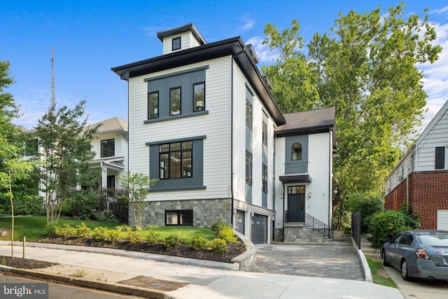 3819 NW Albemarle St NW, Washington, DC 20016 - contemporary home with a garage, driveway, and stone siding