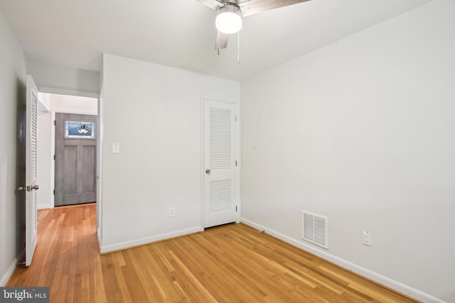 906 N Belgrade Rd, Silver Spring, MD 20902 - unfurnished bedroom with baseboards, light wood-style floors, and a ceiling fan
