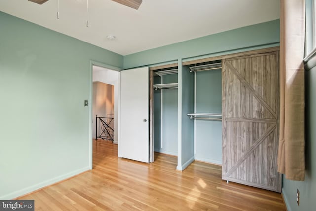 906 N Belgrade Rd, Silver Spring, MD 20902 - unfurnished bedroom featuring wood finished floors and baseboards