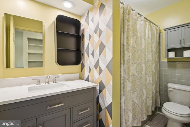 906 N Belgrade Rd, Silver Spring, MD 20902 - bathroom with vanity, toilet, wallpapered walls, curtained shower, and tile walls