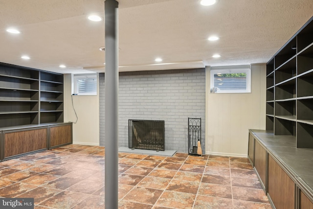 906 N Belgrade Rd, Silver Spring, MD 20902 - below grade area featuring plenty of natural light, recessed lighting, a fireplace, baseboards, and a textured ceiling