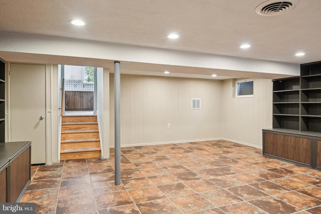 906 N Belgrade Rd, Silver Spring, MD 20902 - below grade area featuring stairway, baseboards, recessed lighting, and stone finish floors