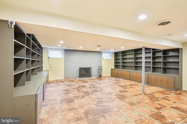 906 N Belgrade Rd, Silver Spring, MD 20902 - basement featuring a fireplace, recessed lighting, plenty of natural light, and stone finish floors