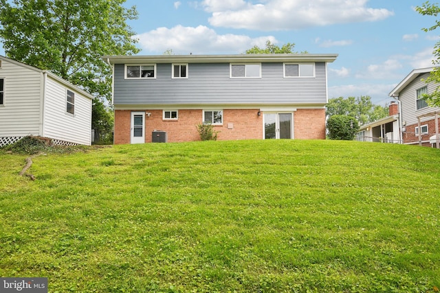 906 N Belgrade Rd, Silver Spring, MD 20902 - rear view of property with brick siding, cooling unit, and a yard