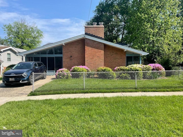 906 N Belgrade Rd, Silver Spring, MD 20902 - view of home's exterior with brick siding and a chimney