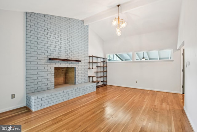 906 N Belgrade Rd, Silver Spring, MD 20902 - unfurnished living room with wood finished floors, a chandelier, baseboards, and a brick fireplace