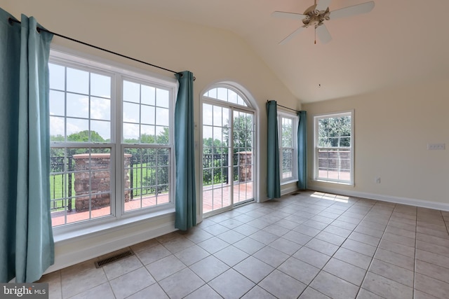 doorway to outside with ceiling fan, plenty of natural light, lofted ceiling, and light tile patterned floors