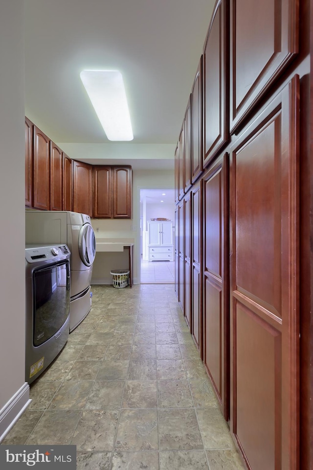 laundry area with cabinets and washer and dryer