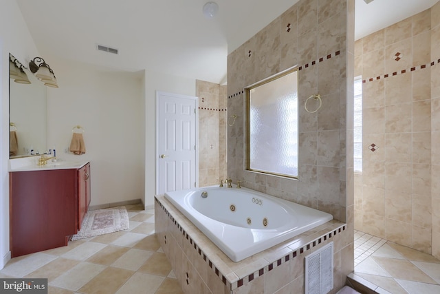 bathroom featuring shower with separate bathtub, tile walls, tile patterned floors, and vanity