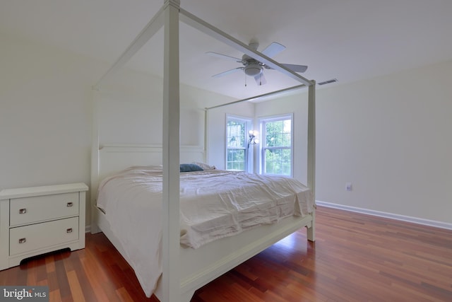 bedroom featuring dark hardwood / wood-style floors and ceiling fan