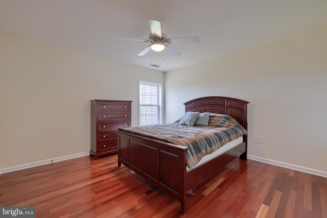 bedroom featuring dark hardwood / wood-style flooring and ceiling fan