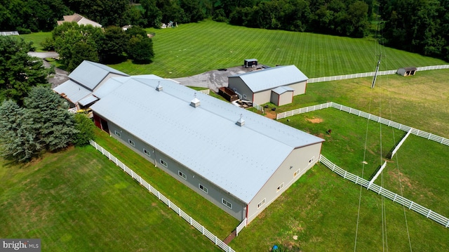 birds eye view of property with a rural view