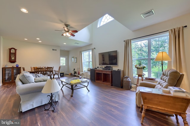 living room featuring dark hardwood / wood-style floors and ceiling fan