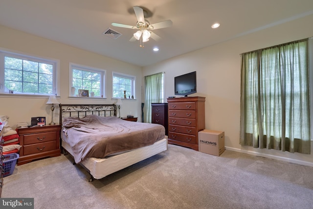 carpeted bedroom with ceiling fan