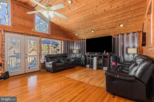 living area featuring a ceiling fan, wooden ceiling, french doors, light wood-type flooring, and high vaulted ceiling