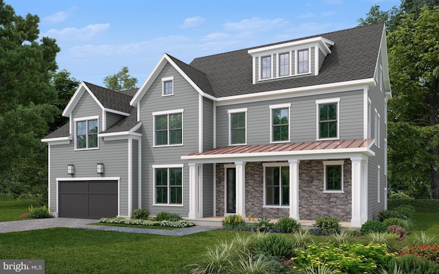 view of front of house with a garage and a front yard