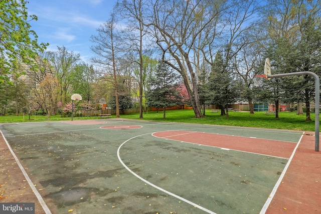 view of basketball court featuring a lawn