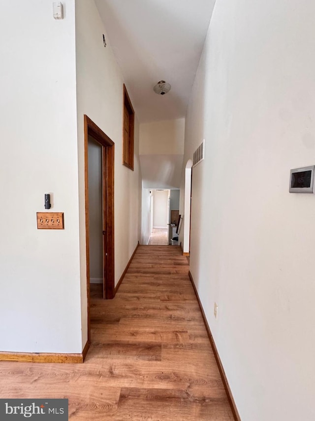 corridor featuring hardwood / wood-style flooring