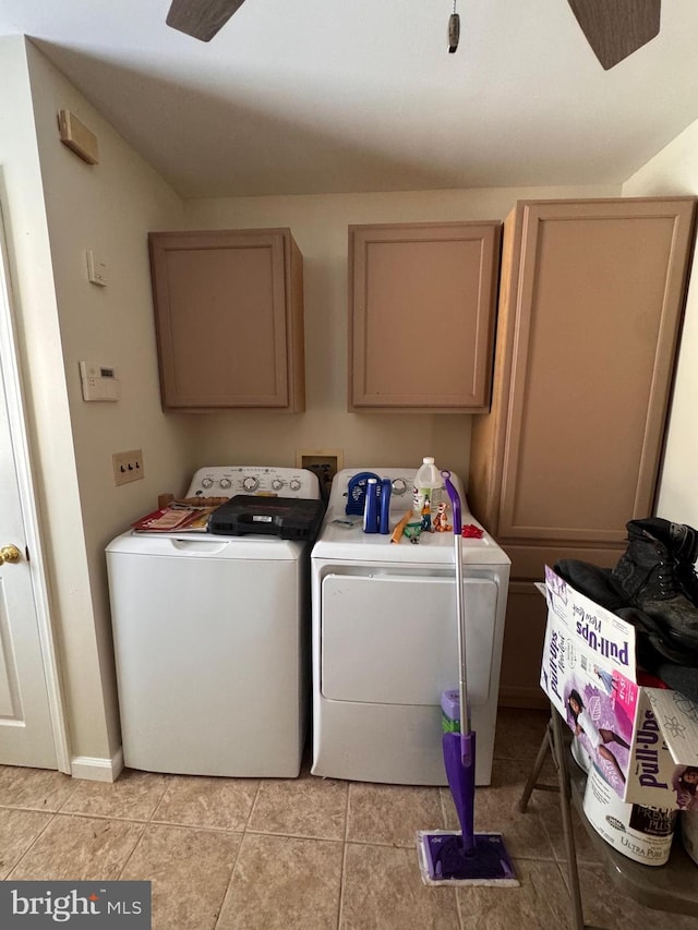 laundry room with cabinets, washing machine and dryer, light tile patterned flooring, and ceiling fan