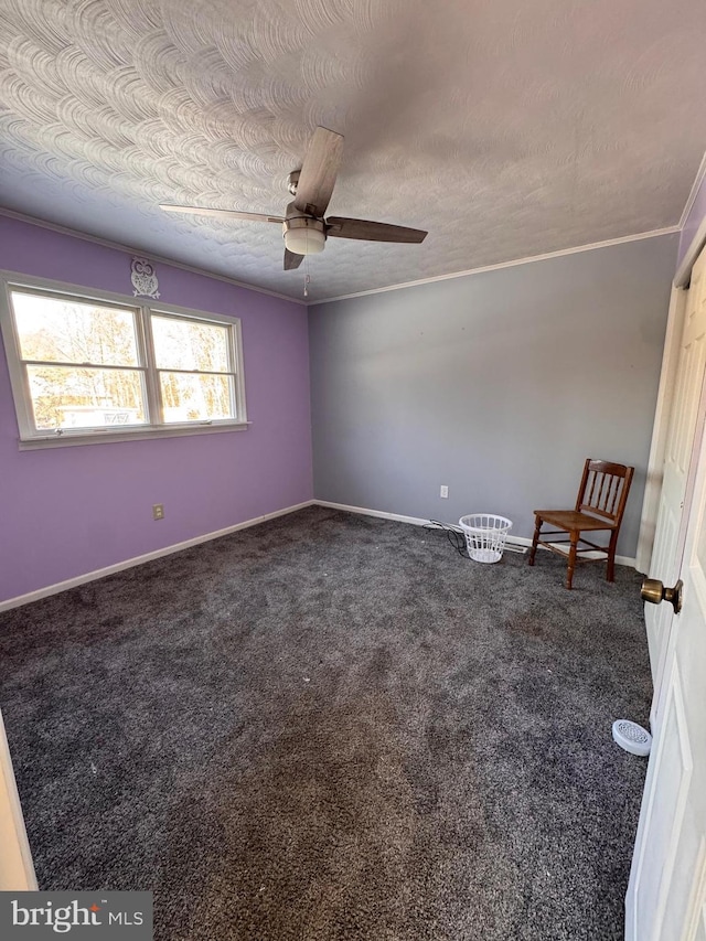 unfurnished room featuring ceiling fan, a textured ceiling, and dark colored carpet