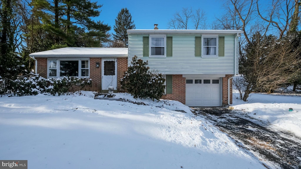 split level home featuring a garage