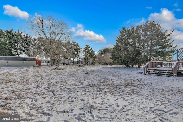 view of yard featuring a wooden deck