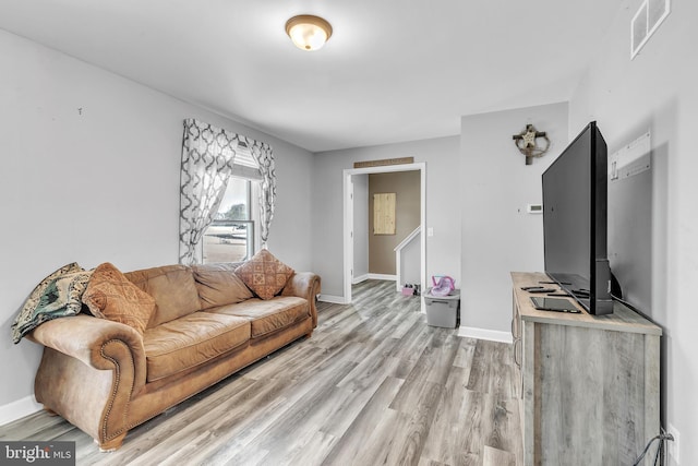 living room with light hardwood / wood-style floors