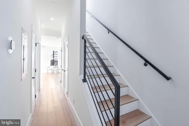 stairway featuring hardwood / wood-style flooring