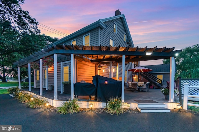 view of front facade featuring a deck and a pergola