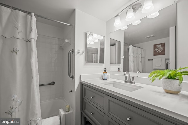 bathroom with vanity and shower / tub combo with curtain