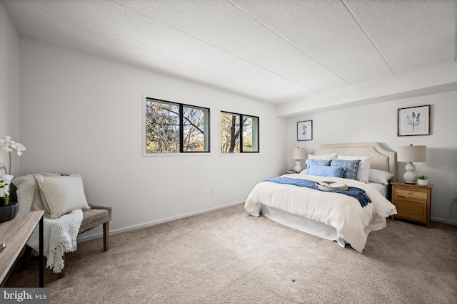 carpeted bedroom featuring a textured ceiling