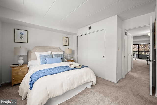 bedroom featuring a closet and carpet flooring