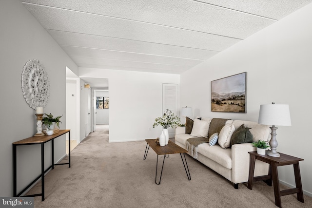 living room with light colored carpet and a textured ceiling