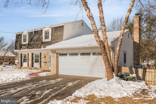 view of front of property featuring a garage