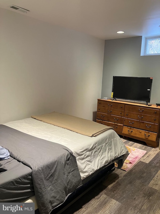 bedroom featuring hardwood / wood-style floors