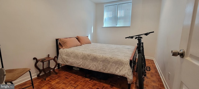 bedroom featuring dark parquet floors