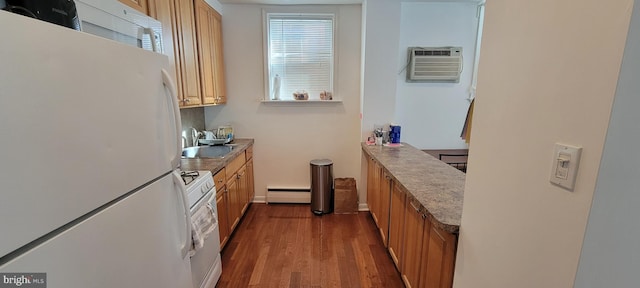 kitchen featuring a wall mounted air conditioner, a baseboard radiator, sink, dark wood-type flooring, and white appliances