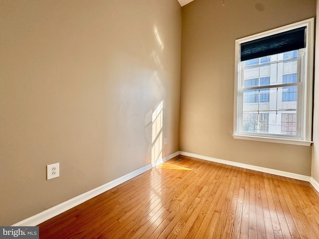 spare room featuring light wood-type flooring